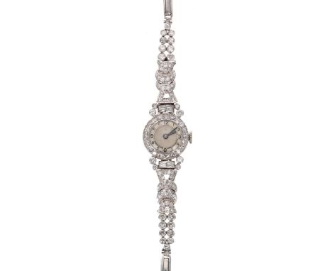 Attractive platinum diamond set lady's  cocktail wristwatch, silver dial with Arabic numerals, with round-cut and baguette di