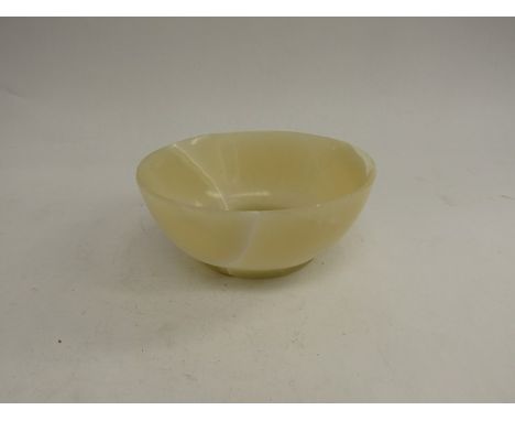 A late 19th Century Jade bowl, nibbled, 11cm diameter