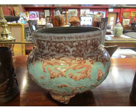 A Chinese ceramic censor decorated in puce with five toed dragon, character mark to base, 26cm tall