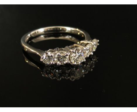 An 18ct white gold five stone diamond ring, 1.40ct diamond approximately, size R/S, 4g