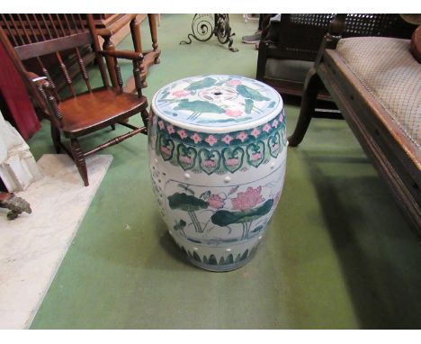 An Oriental ceramic garden seat of drum-form, white ground with bird and foliate design