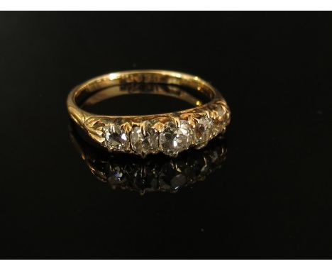 A gold five stone diamond ring, set with old cut graduated diamonds, .65ct approximately, stamped 18ct, size P/Q, 2.5g 