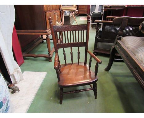 An Arts and Crafts ash and elm childs elbow chair with carved and ring turned decoration 