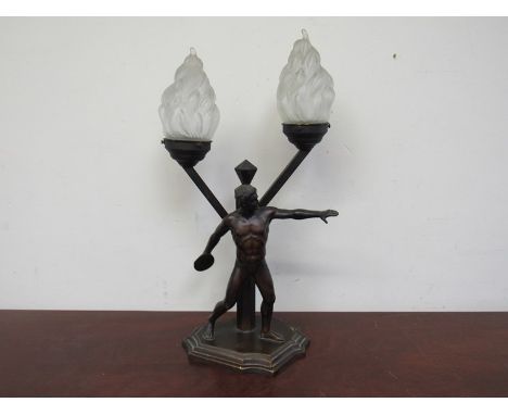 An Art Deco lamp with discus thrower design, pair of flame form shades