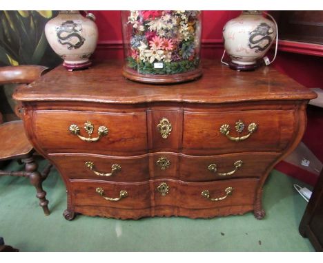 An 18th Century French chateau pine commode chest of two over two long drawers with ornate brass fittings 