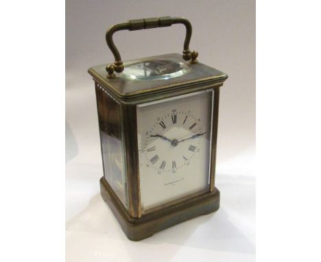 A late 19th Century brass cased striking carriage clock, Roman enamelled dial, signed Pim Brothers Ltd, Paris, with leather c