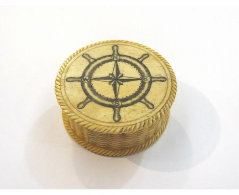 A 19th century bone patch box with ships wheel and compass decoration, 6cm diameter
