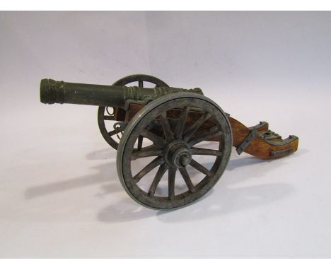 A modern miniature model of a Louis XIV style cannon