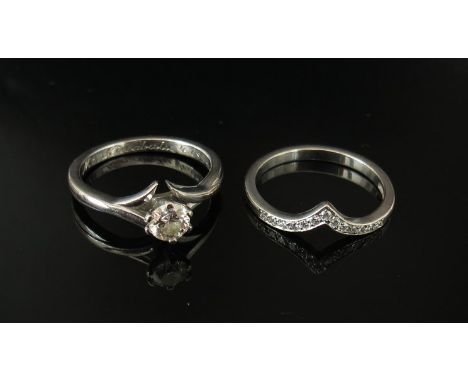 A diamond solitaire ring with certificate .41ct, SI1, colour E, with interlocking diamond set band. Size M, 6.3g