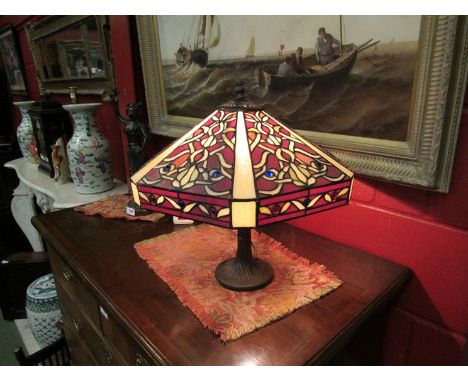 A Tiffany style lead glass table lamp on naturalistic base 