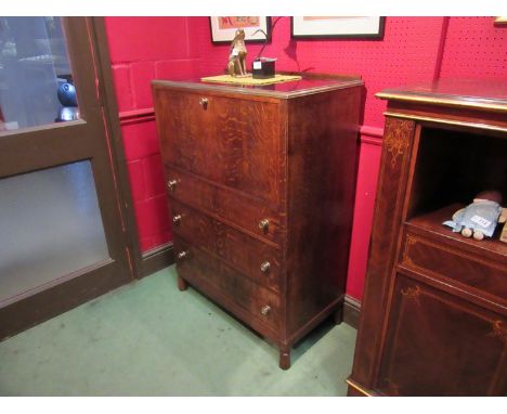 A Circa 1920-30 oak cabinet with drop-down flap over three drawers with brass surround top, made by Makintosh of Glasgow, mak