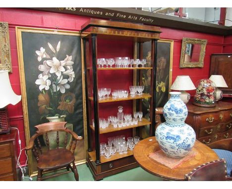 A five tier shelf with ebonised pillars and castellated decorative arched top over a single base drawer