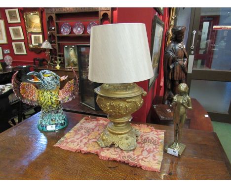 An ormolu table lamp base with classical putti design, cream shade