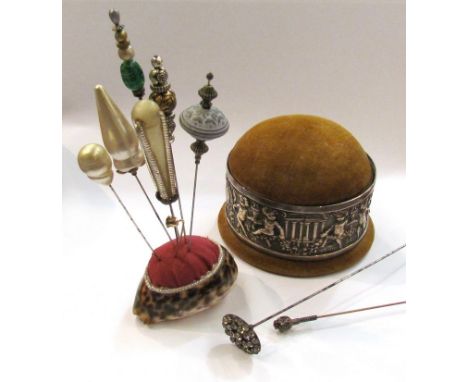 A silver banded pin cushion/ trinket pot and quantity of hat pins 