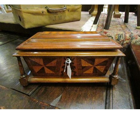A Tunbridge Ware tea caddy, decorated with Vandyke Veneers and corner columns circa 1825 14" wide, original key and lock