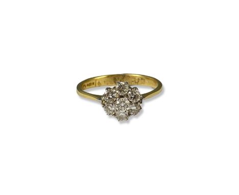 18ct Yellow Gold Diamond Flower Style Cluster Ring Comprising of 7 Round Cut Diamonds with a total weight of approximately 0.