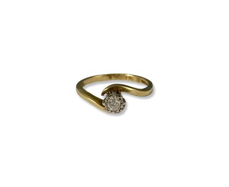 9ct Yellow Gold Illusion Style Diamond Twist Ring Comprising of a round cut diamond weighing approximately 0.10cts - weighing