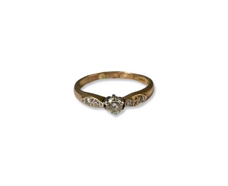 9ct Diamond Solitaire Ring with Diamond Shoulders Comprising of a Round cut Diamond Centre Stone weighing approximately 0.20c