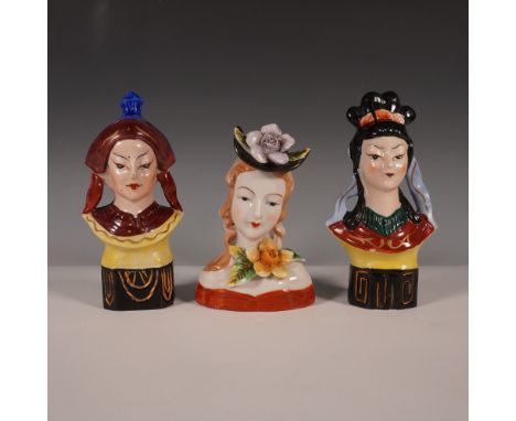 A set of three vintage ceramic bust figurines, each featuring a distinct female figure with hand-painted details and a glossy