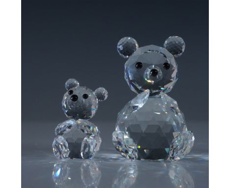 A charming set of Swarovski crystal bear figurines, featuring a larger bear measuring 2.75"H and a smaller companion. Crafted