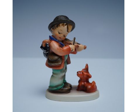 Charming Goebel Hummel figurine titled Puppy Love, depicting a young boy playing the violin for an adoring dog. This hand-pai