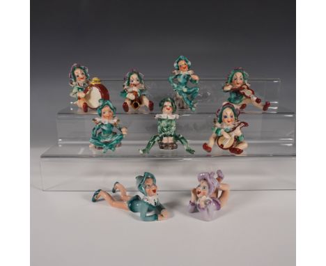 This charming collection features musical clowns playing various instruments, along with two reclining jesters, each adorned 