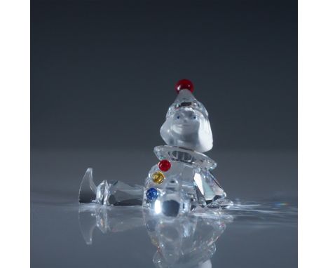 A charming Swarovski crystal figurine titled Puppet, model number 217207, designed by Gabriele Stamey. This whimsical piece f