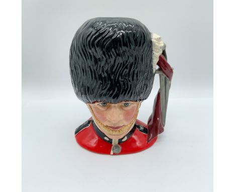 This is a large Royal Doulton character jug titled "The Guardsman," model number D6755. Designed by Stanley James Taylor, thi