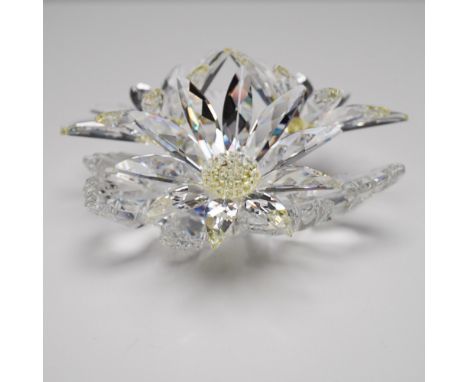 Exquisite Swarovski crystal floral arrangement from the "Secret Garden" theme. This stunning piece features three faceted cle