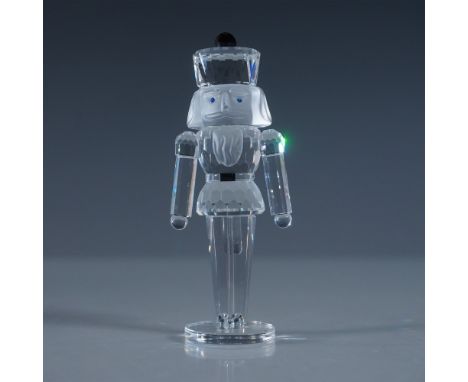 A magnificent Swarovski Silver Crystal Nutcracker, expertly designed with a faceted clear crystal body, frosted crystal face,