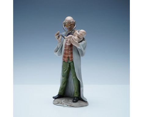 Charming Capodimonte porcelain figurine depicting a doctor examining a baby. Designed in a whimsical yet detailed style, the 
