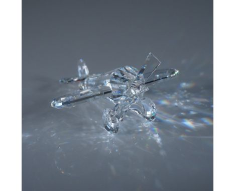 A stunning Swarovski Silver Crystal Airplane, expertly crafted with precision-cut clear crystal. This elegant aviation-inspir