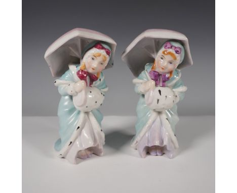 These charming figures depict young women in Victorian-style attire, each elegantly dressed in pastel blue cloaks with white 