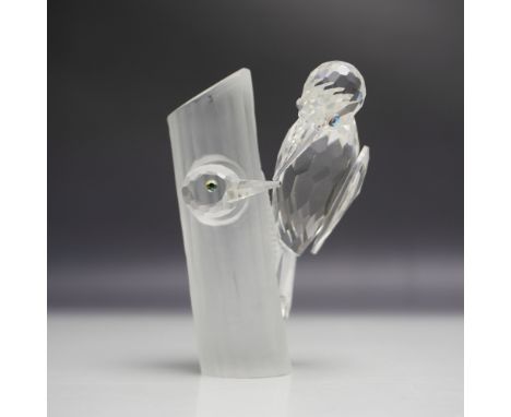 A Swarovski SCS Woodpeckers crystal figurine, released in 1988 as part of the Caring and Sharing series. This stunning piece 