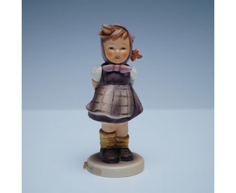 This charming Goebel Hummel figurine, Which Hand?, model number 258, features a young girl in a purple dress and headscarf, p