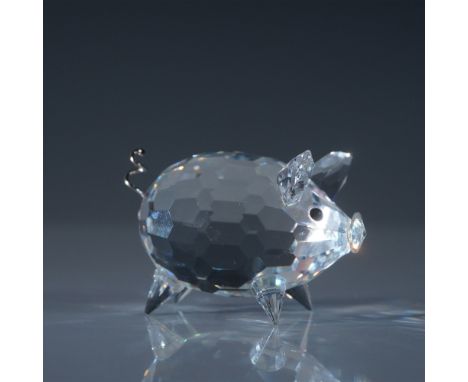 This charming Swarovski Silver Crystal Pig features a faceted clear crystal body with a playful curled metal tail and black c