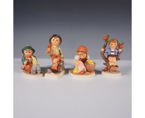 A charming set of four vintage Goebel Hummel figurines, crafted in Germany. Each figurine captures a nostalgic scene of child