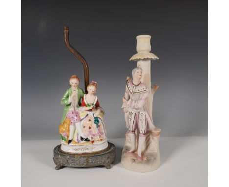 A pair of vintage Occupied Japan porcelain pieces, including a lamp base featuring a seated courting couple on a decorative m