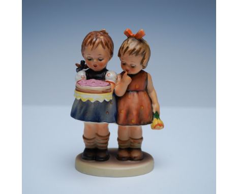 Charming Goebel Hummel figurine titled Happy Birthday, featuring two young girls in a heartwarming moment, one holding a birt