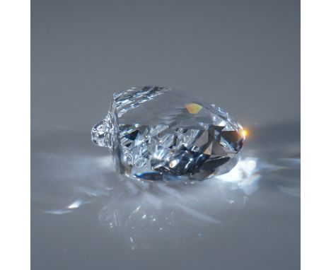 A stunning Swarovski crystal scallop shell figurine, expertly crafted with brilliant faceting that captures the beauty of the