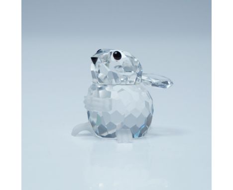 Tiny mouse looking upwards with a clear cut crystal body with black eyes and nose. Swarovski backstamp.  This item has its or