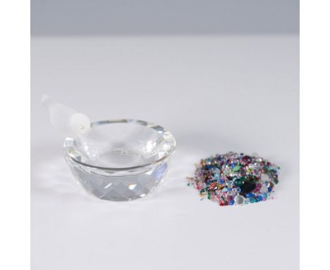 A delicate crystal trinket dish featuring a finely sculpted frosted glass bird perched on the rim. The dish is crafted from c