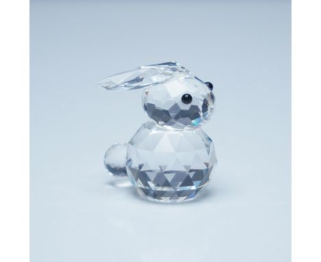 This exquisite Swarovski crystal bunny figurine is crafted with intricate facets that reflect light beautifully. Measuring 1"