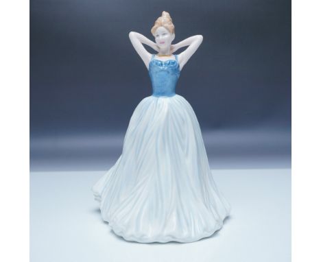 The Royal Doulton Finishing Touch HN4329 figurine captures a moment of elegance, depicting a refined lady gracefully adjustin