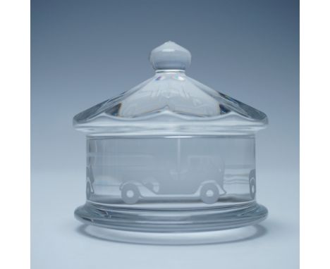 This Baccarat crystal merry-go-round paperweight features an elegant etched design of vintage automobiles encircling its cyli