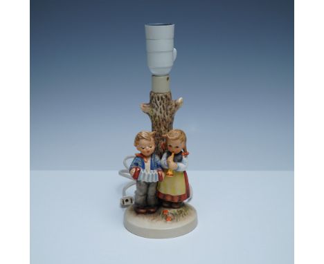 Charming vintage Goebel Hummel porcelain table lamp titled Birthday Serenade. This delightful piece features two children pla