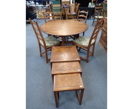 AN ERCOL NARROW DROP-LEAF DINING TABLE with oval elm top 128cm wide, with four Ercol ladderback chairs, and a nest of three G