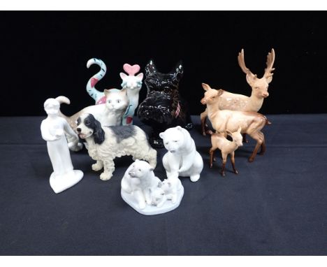 A COLLECTION OF ANIMAL MODELS including Lladro, Nao, Royal Doulton and a Beswick deer family