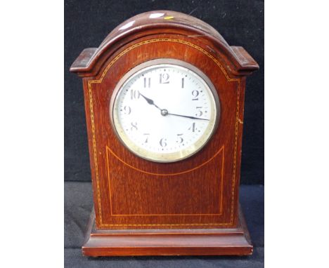 AN EDWARDIAN MAHOGANY MANTEL CLOCK with white enamel dial, 24cm high, with key