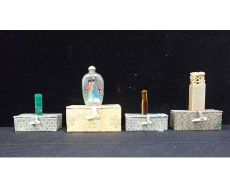 A GLASS SNUFF BOTTLE with inside painted decoration and three seals, jade, malachite and onyx, (two uncut), all with fitted d